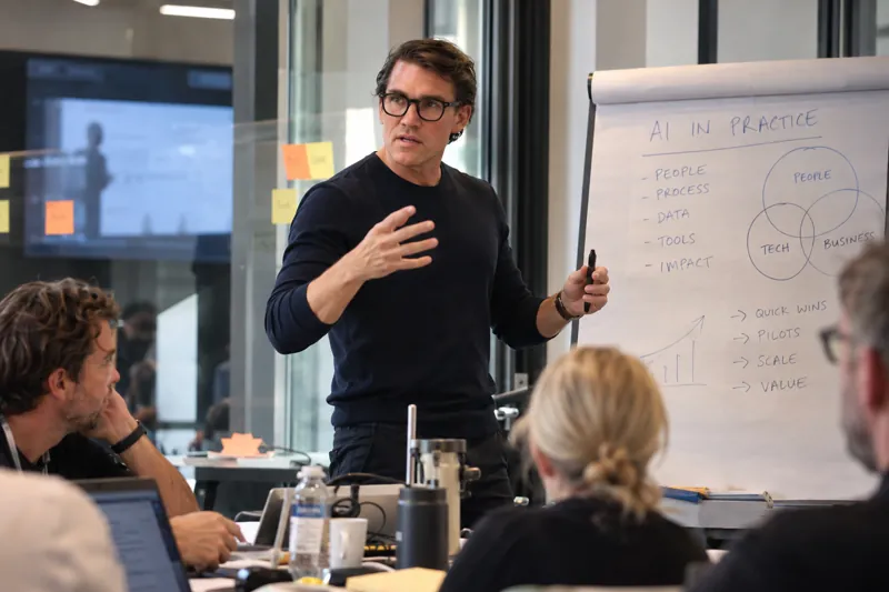 Karl Lillrud explaining AI in practice on a flipchart