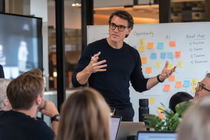 Karl Lillrud mapping AI opportunities on a whiteboard with a team