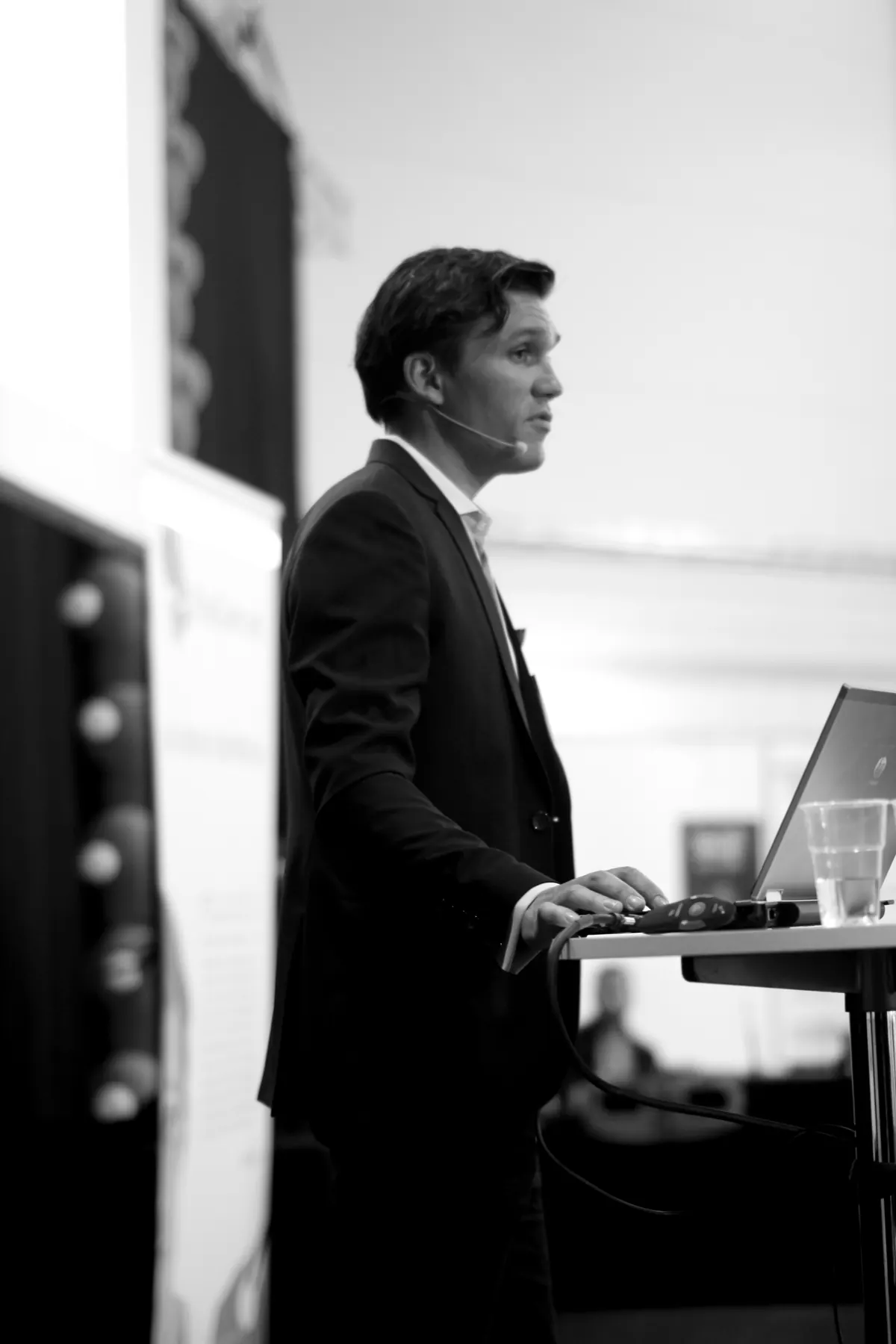 Karl Lillrud delivering a keynote at a lectern