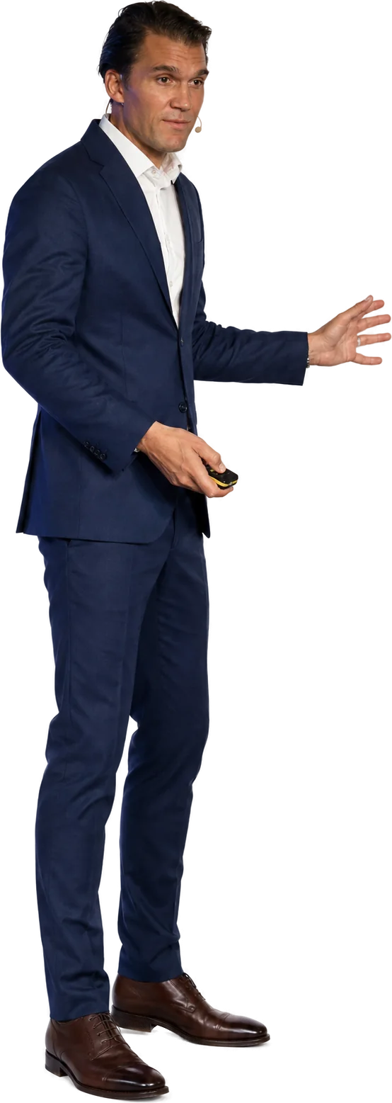 Karl Lillrud on stage, gesturing toward the audience